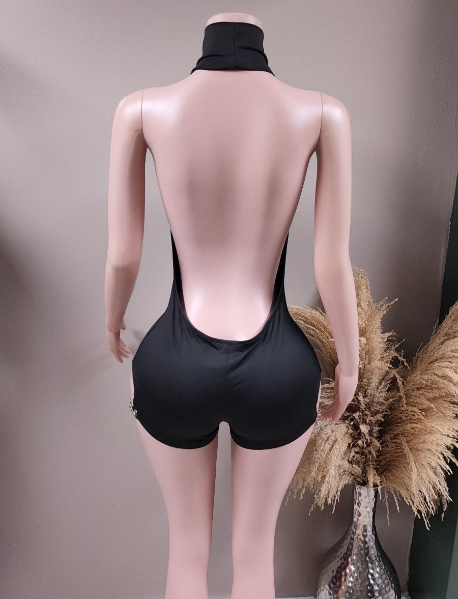 Compromised backless romper